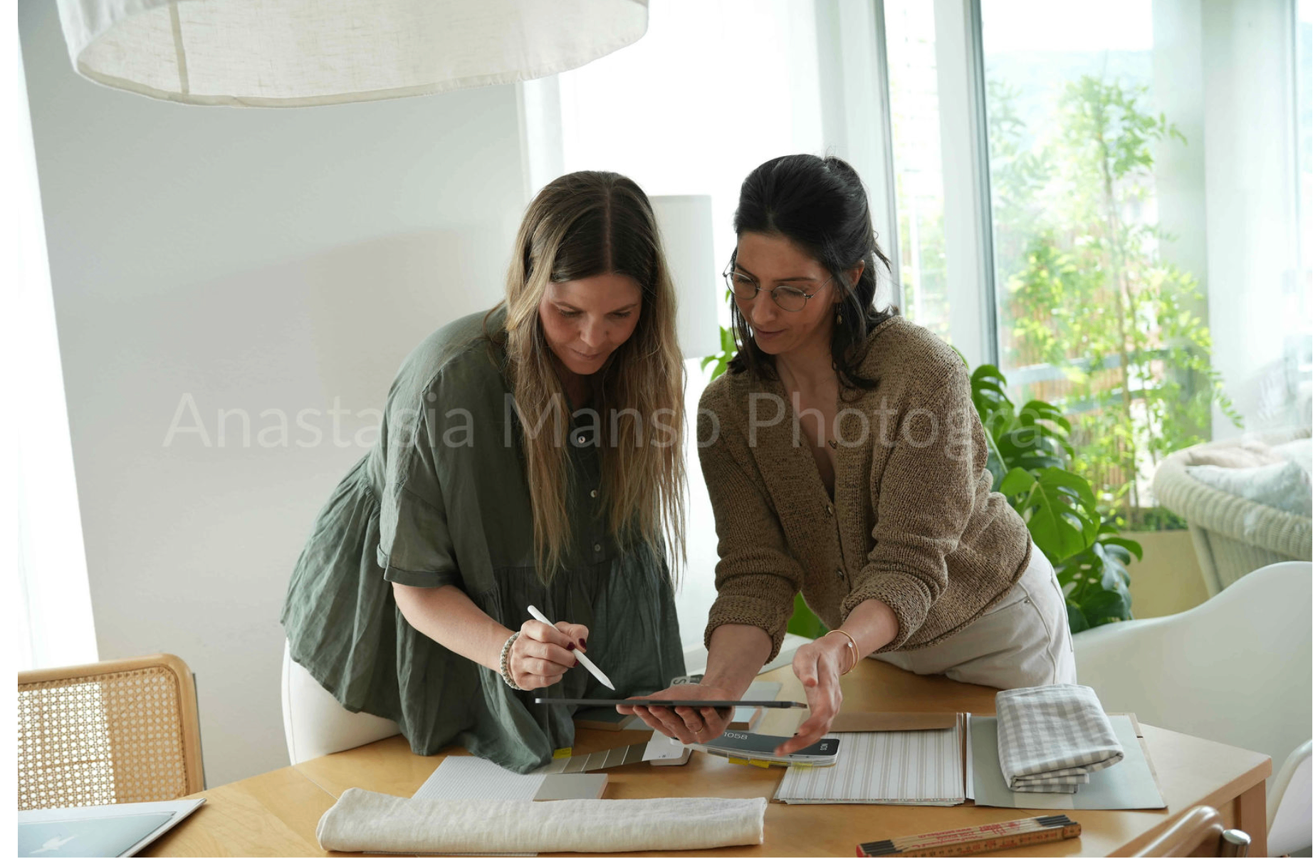 Paola Casacuberta and Andrea Zupan-Dover, founders of 2AM Studio, working at their studio desk in Zurich